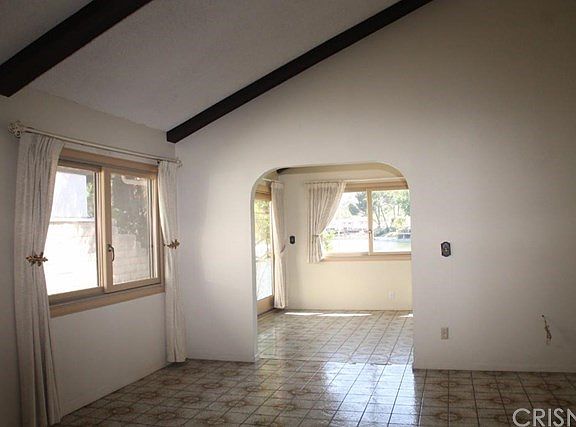 Large Living Room Opens To Sunroom