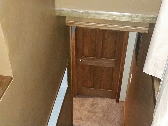 stairs to the 2 other bedroo