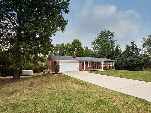 Corner lot with side gravel drive way