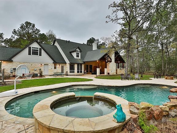Single solid Door on back of house enters into garage and the single French Door leads in the MUD/Laundry area. In between the 2 doors is an outdoor shower to rinse off!