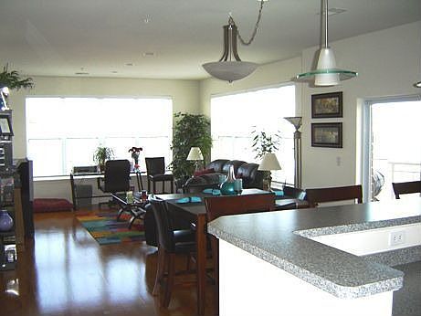 Living Room with walls of windows & lake views