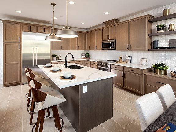 Gourmet kitchen has sink placed at the kitchen island Lots of kitchen counter space for food prepa
