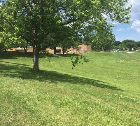 Exterior view from front of house, the back of the elementary school