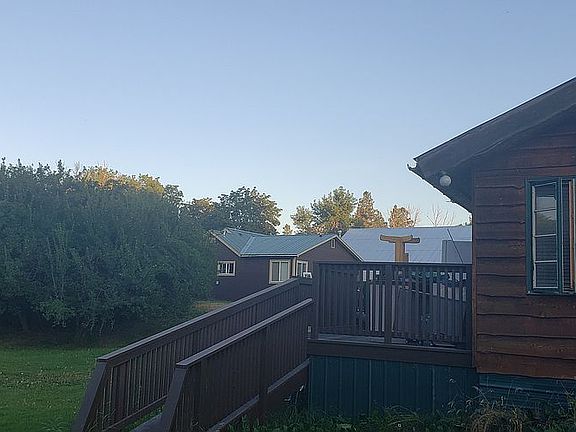 Side view of cottage and mai