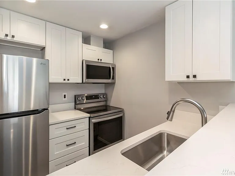 Kitchen with all stainless steel appliances
