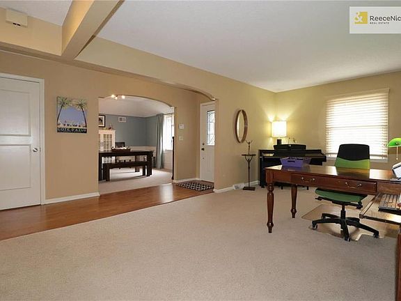Living Room Open to Entry Hall & Dining Room Beyond.