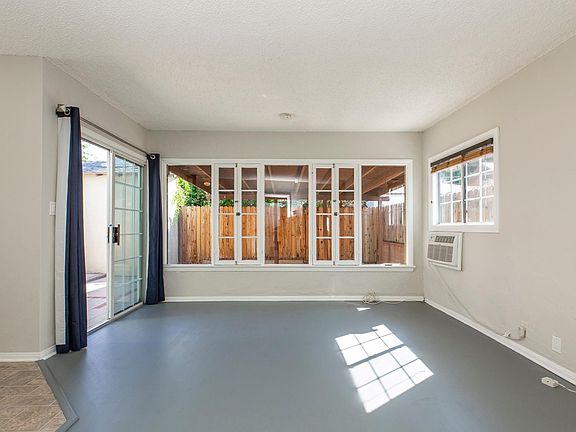 Living space with view to the private covered patio.