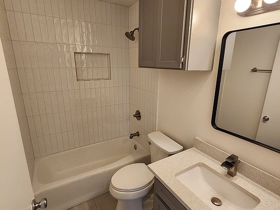 Hall bathroom - new floor tile, shower tile & toilet