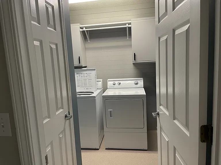 Washer and dryer included in laundry room. 1/2 bath to the right