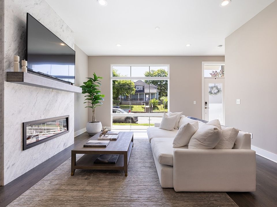 Generous, main-level living, dining, kitchen space w/ fantastic natural light, tall ceilings, modern finishes
