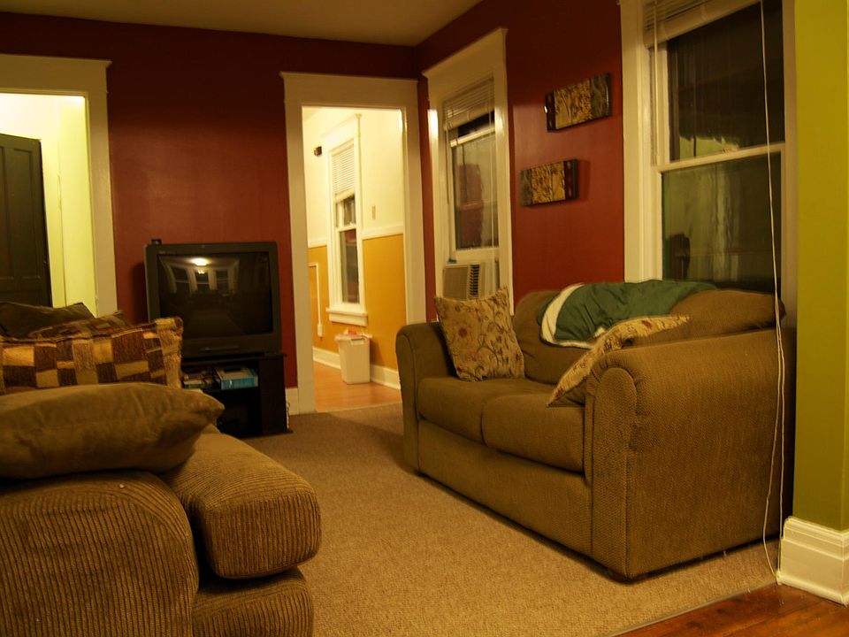 living room leading to kitchen and hallway