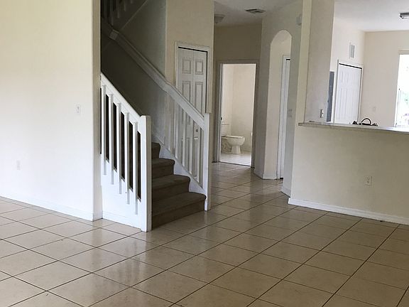 Hallway, guess bath, stairs on first floor