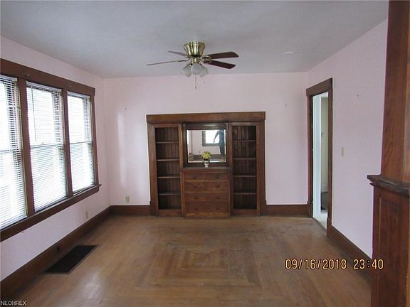 The living room is open to the dining room with built ins and easy access to the kitchen and bathroom.