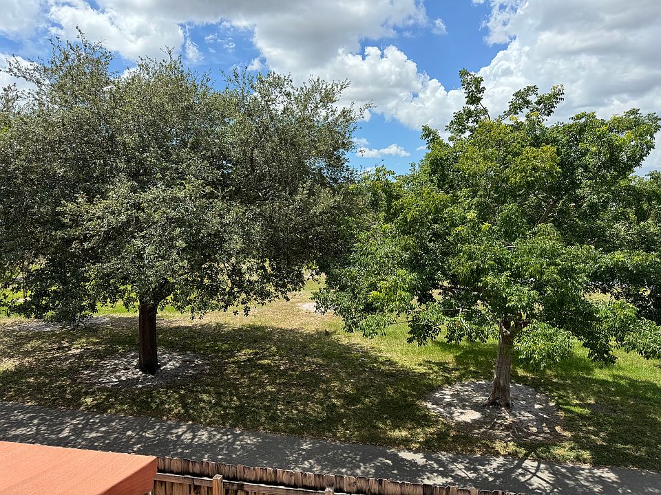 View from master bedroom of walking park behind unit