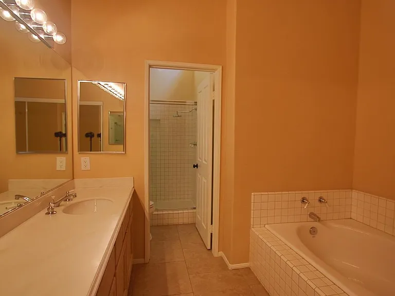 Master bathroom with deep tub and separate shower