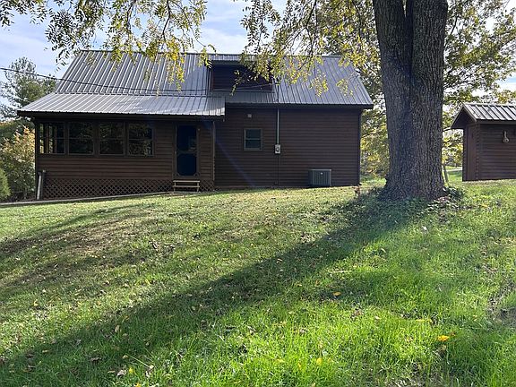 Rear of house- back door is within an all weather porch.