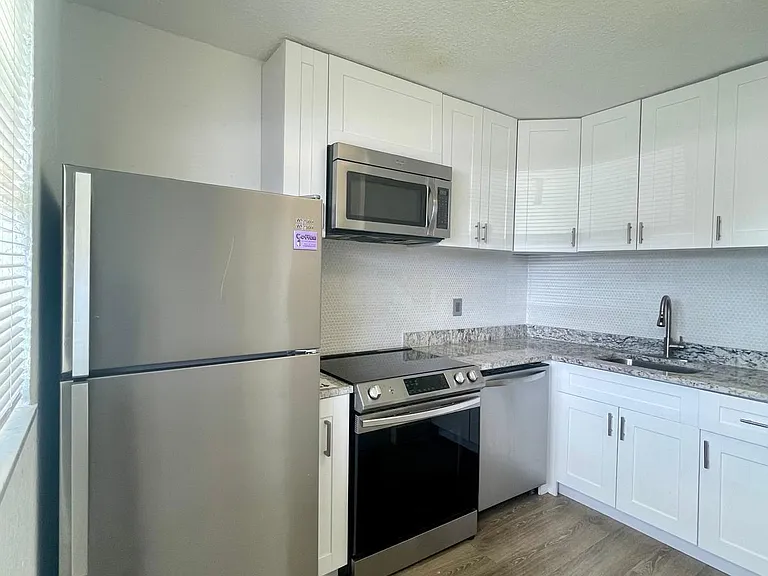 651 NW 42nd Ct #118 — Photo 30