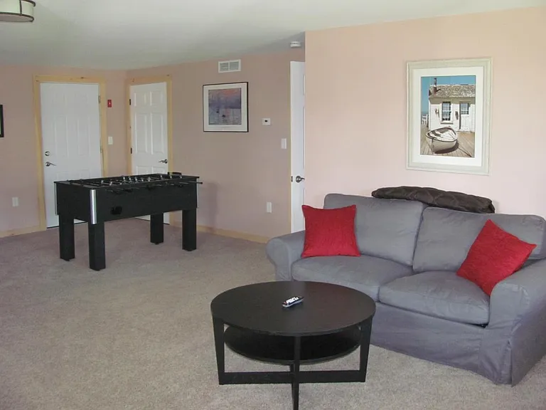 Lower level family room with Fooseball table and sleeper sof