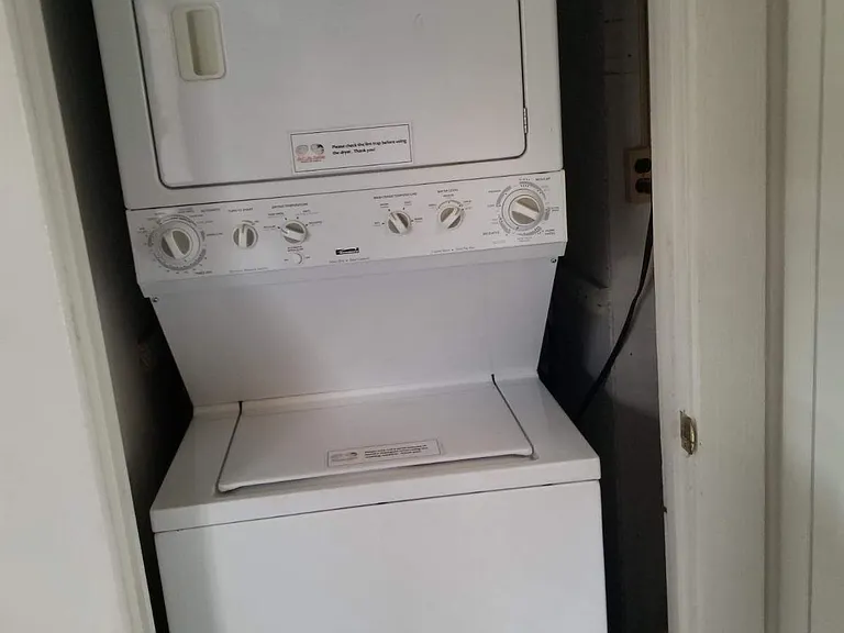 Stacked washer and dryer in bunk bedroom