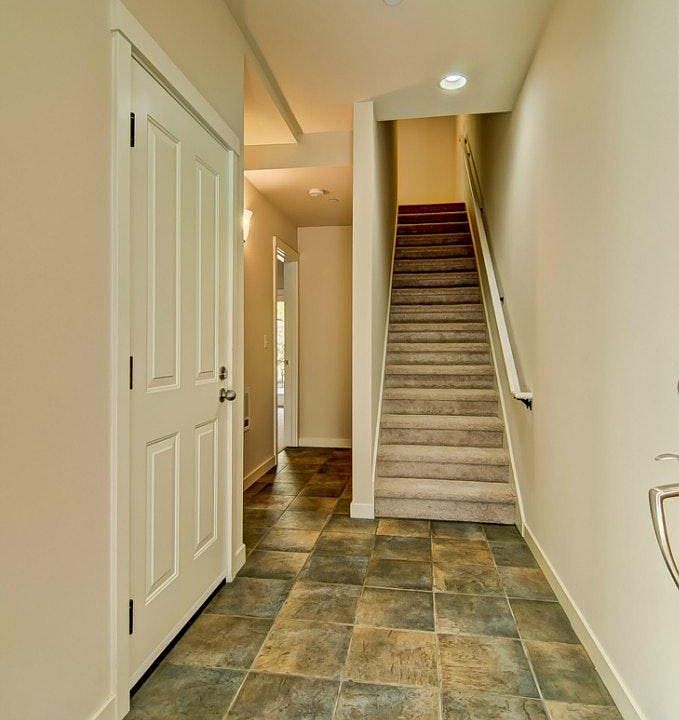 Hallway to first bedroom on 1F and to the living, kitchen room on 2F