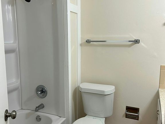(Bathroom): Bright and clean bathroom featuring modern fixtures and a well-maintained design for everyday comfort.