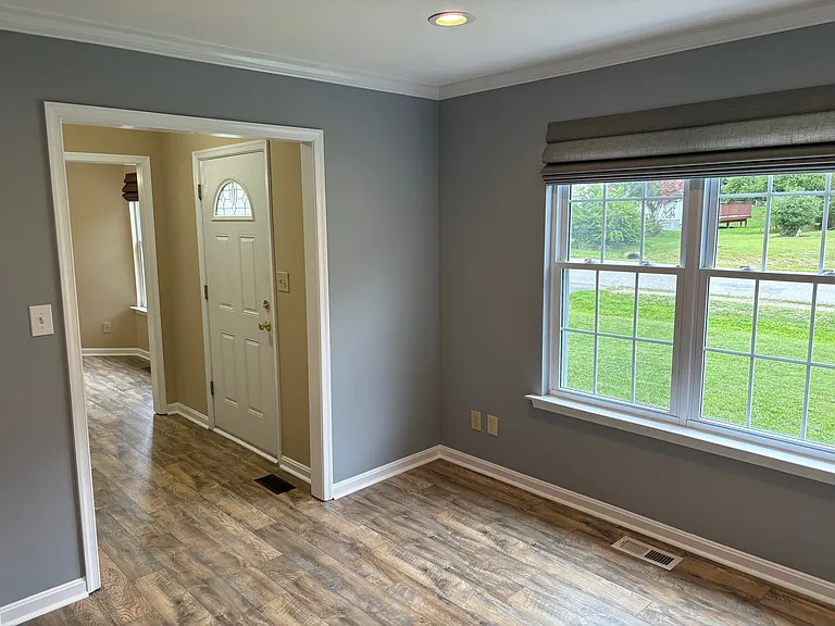 Family room. As you enter front door and opposite from formal dinning room. This space is also ideal for a home office. Recessed lighting with dimmer switch and pull down Roman blinds.