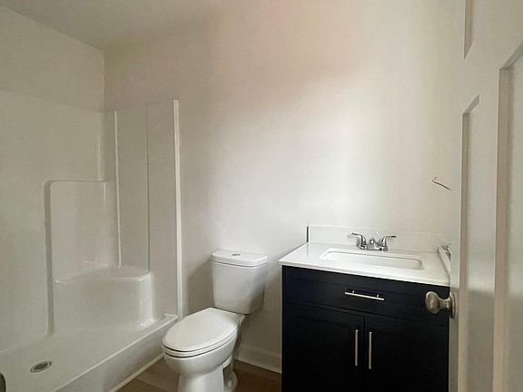 En-suite primary bathroom with walk-in shower