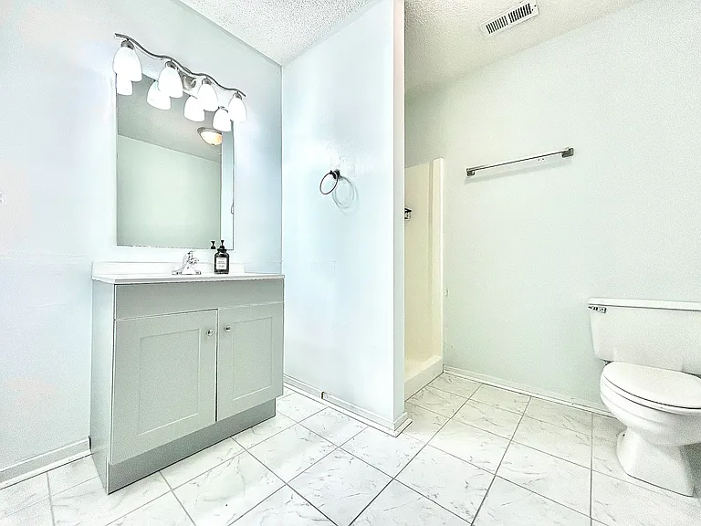 Guest Bathroom with New Tile Flooring and Vanity