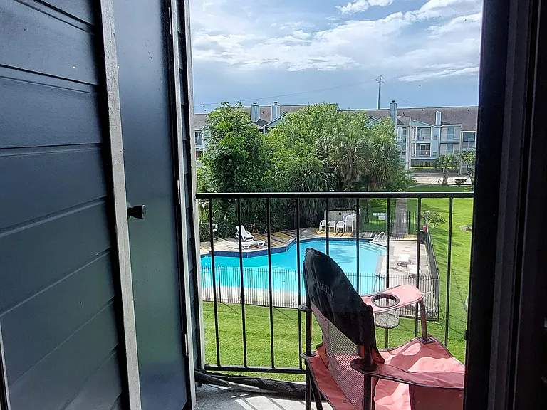 Balcony storage with view of The Villas pool.