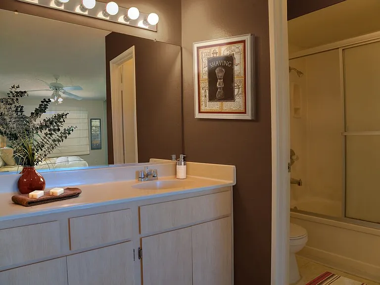 Classic Package I bath with oak cabinetry, and white laminate countertops