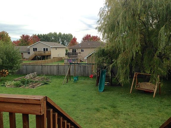 Back Yard
						:
						Large backyard with double raised-bed garden, deck, and patio.
