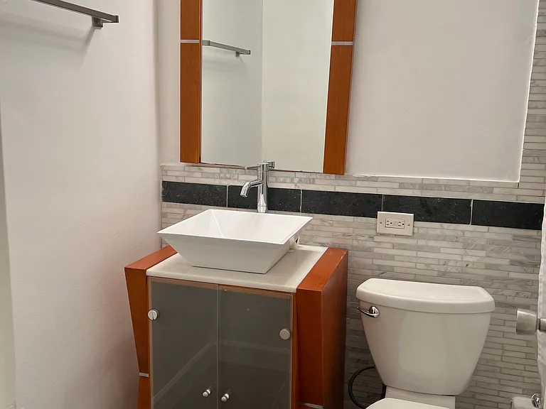 Designer vanity in modern bathroom.