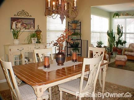 Dining Room
						:
						Spacious Dining Room with sunroom in background