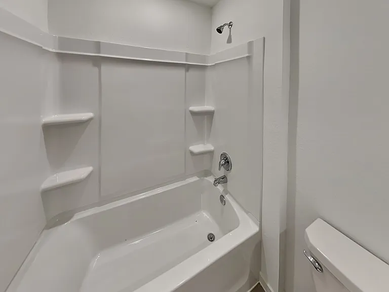 This pristine white bathroom f