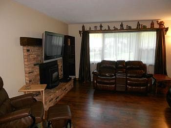 Large window in the living room for natural light.