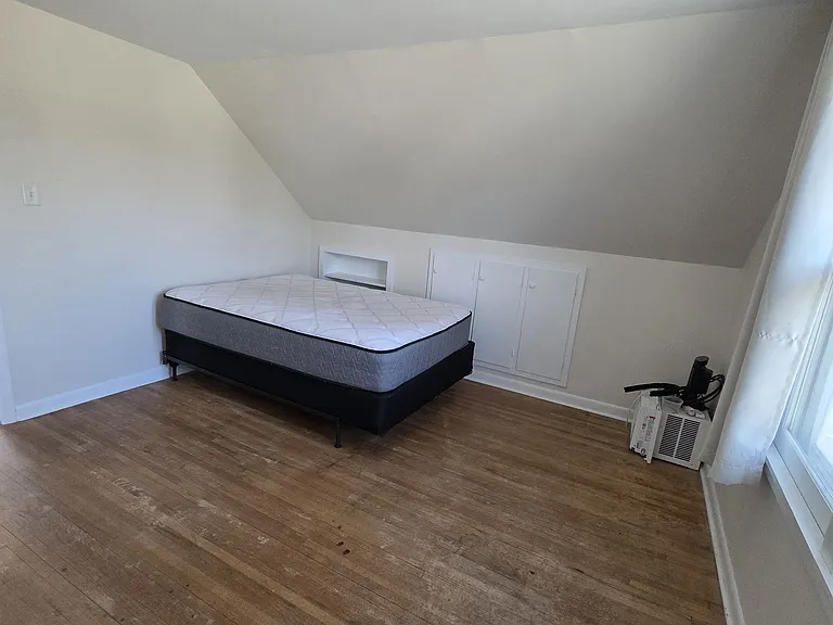Upstairs Bedroom 1 - spacious closet as well as built-in cabinets for storage.