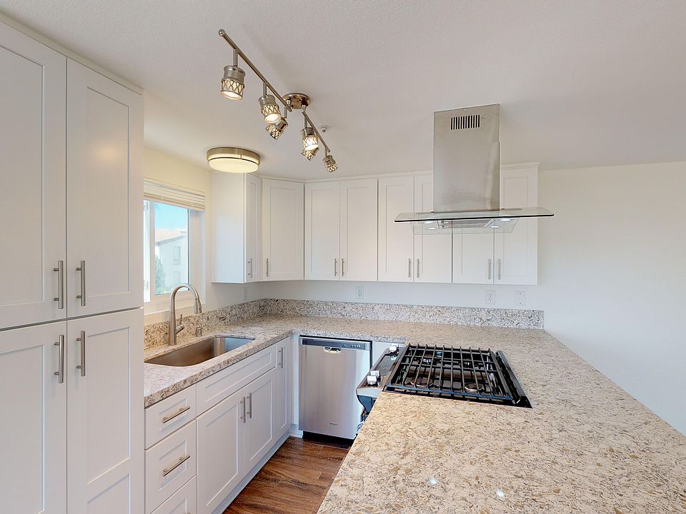 Upgraded kitchen includes fridge, dishwasher, stove/oven, garbage disposal, new kitchen cabinets with quartz counters.