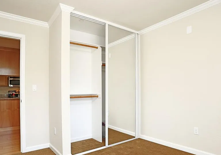3 bedroom, 2 bath, closet of medium bedroom and view of kitchen