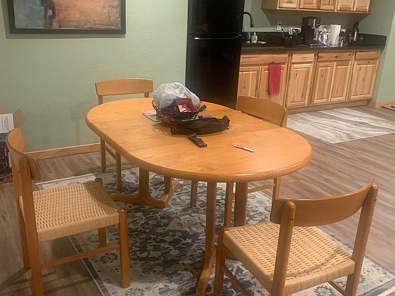 Recently renovated kitchenette area which includes full fridge, microwave, air fryer, and electric hobs for cooking. Plenty of storage with utility shelves.