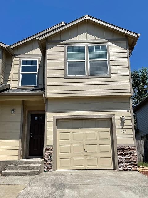 Newly painted with garage and parking in driveway