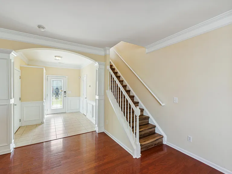 Entrance foyer, entrance bathroom, living room, stairs