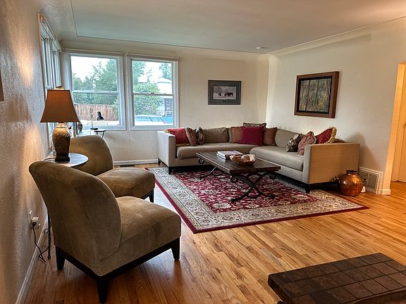 Light, bright and very large living room with hardwood floors