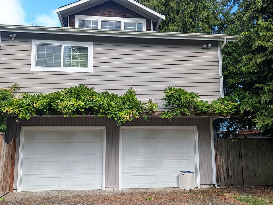 Front of apartment above garages, tenant can tandem park 2 cars in front of left garage and offstreet parking in the yard to the left