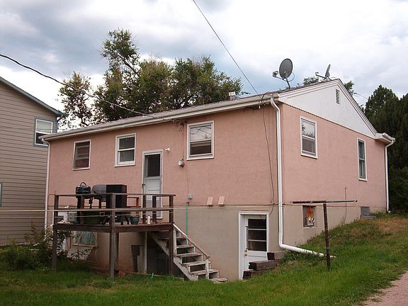 Rear/Side of Home with Deck