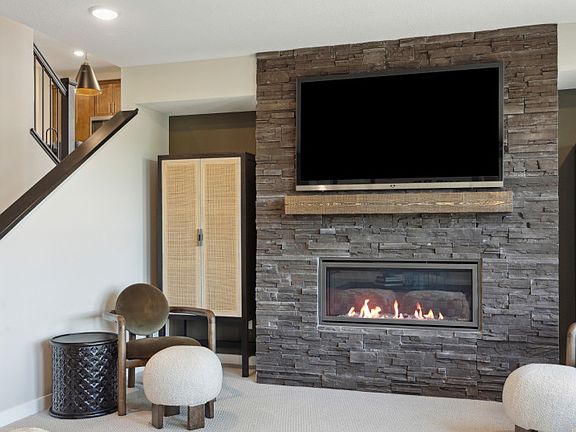 Lower Level Game Room Featuring a Gorgeous Fireplace