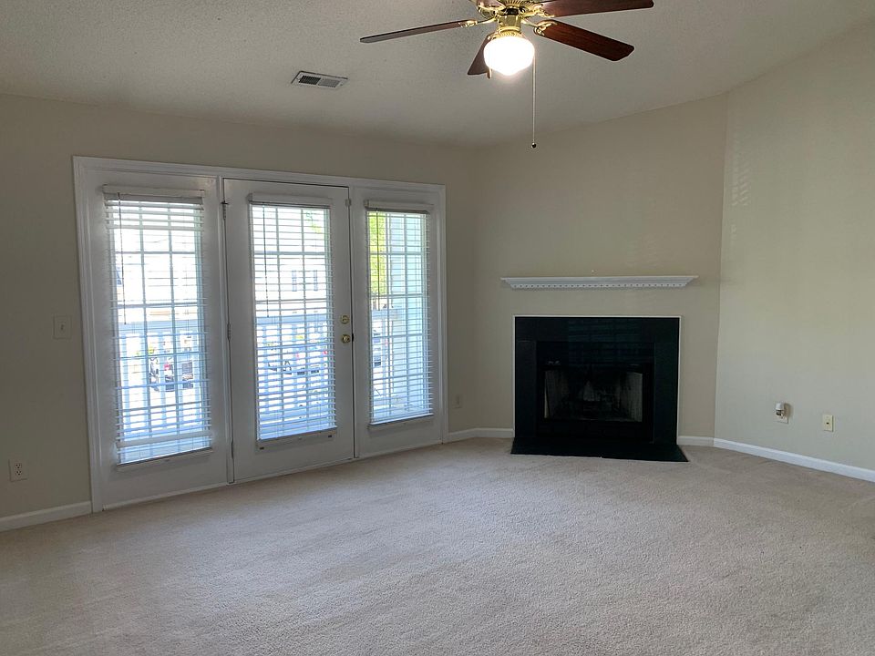 Living room with access to patio and storage