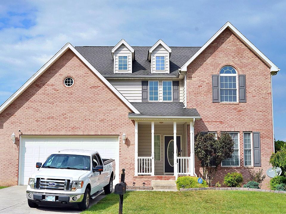 Brick front with large driveway