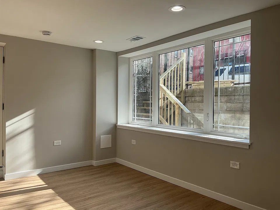 Front entryway and garden space seen through front window