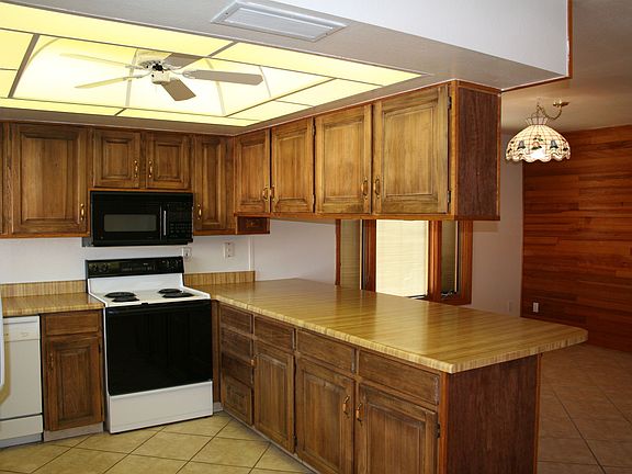 Kitchen opens to backyard & adjoins family room