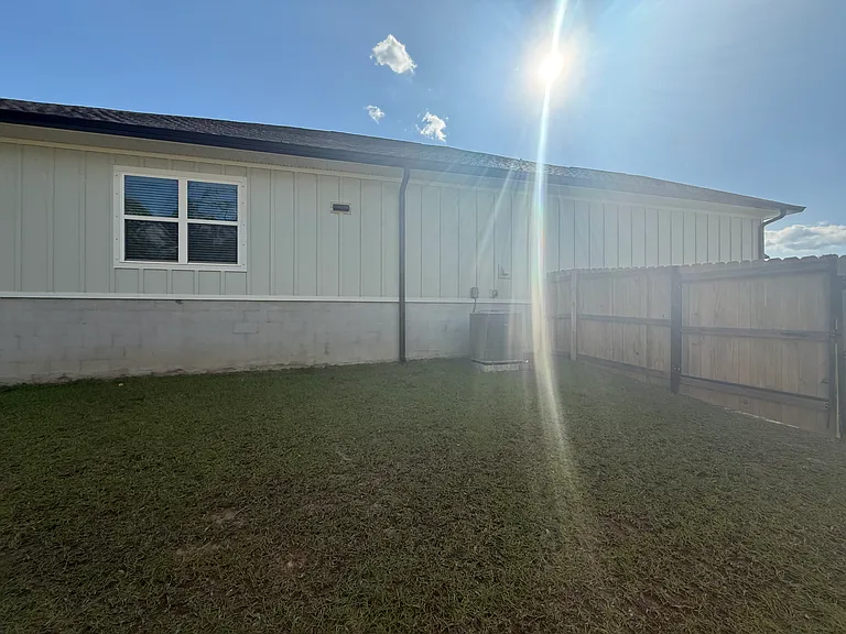 Side of house and another gate